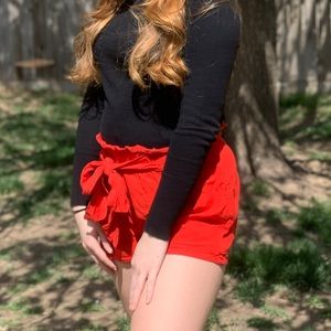 Orange-red flowy shorts, size M